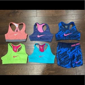 Includes 4 nike sports bras and one set with a bra and nike pro spandex shorts.